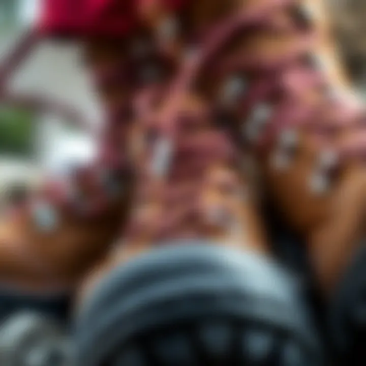 Close-up of alpine-style hiking boots featuring D-ring eyelets and speed hooks, showcasing their classic design and sturdy construction.
