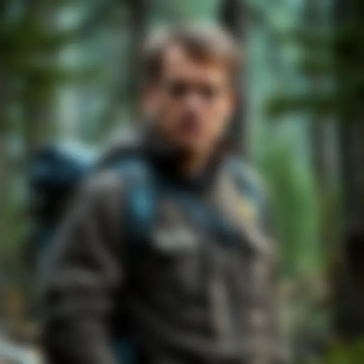 Charlie Kirk dressed in survival clothes, with camping equipment and a thoughtful expression, standing in a forested area