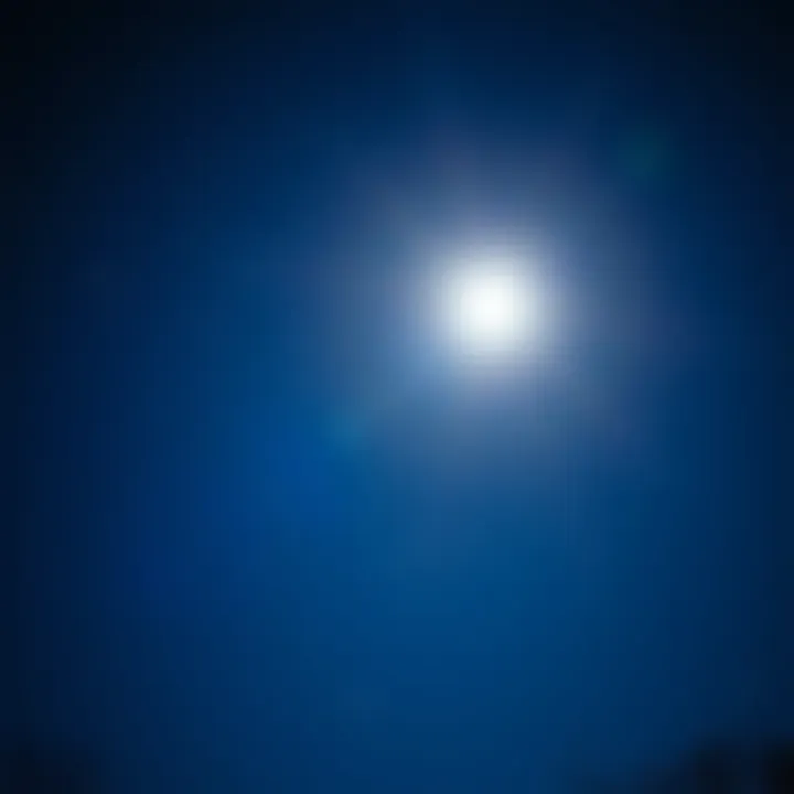 A clear night sky in Ohio with a bright full moon shining down, surrounded by scattered stars.