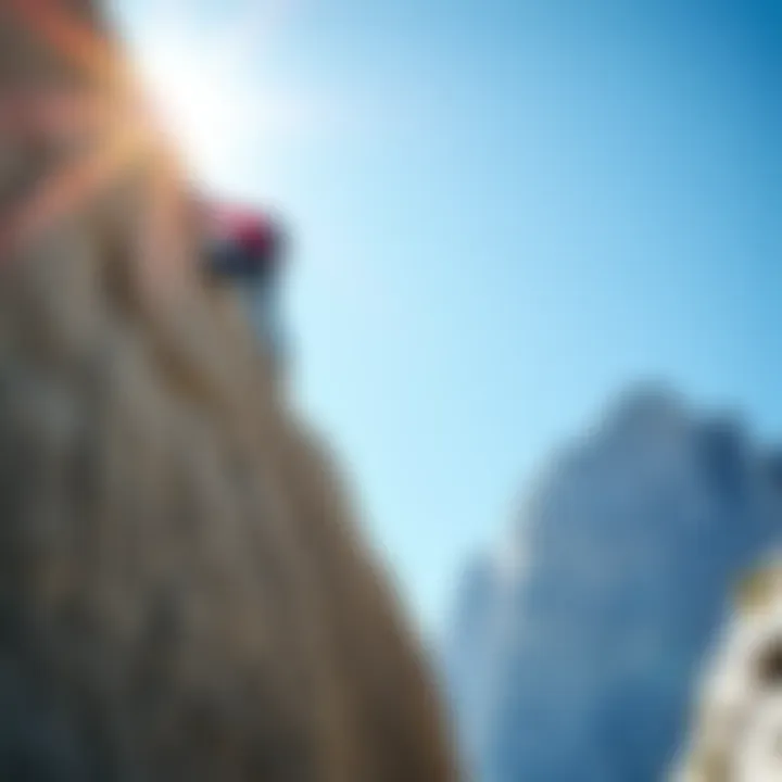A climber scaling a steep rock face against a clear blue sky, symbolizing adventure and achievement.