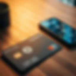 A close-up of a modern crypto debit card lying on a wooden table with a digital currency wallet app shown on a smartphone next to it.