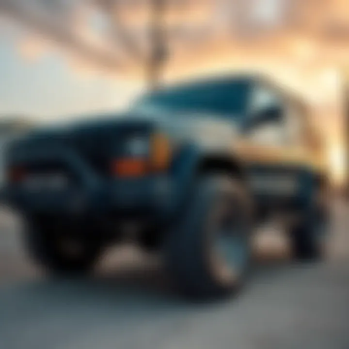 A 1999 Jeep Cherokee Sport parked with slightly worn tires, highlighting the decision to replace them before sale.