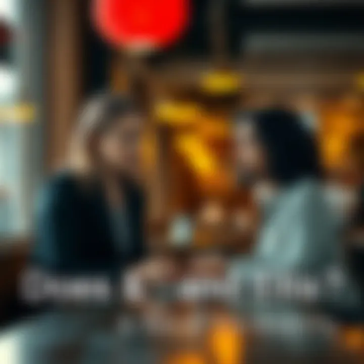 Jess and Ellis sitting at a table in a cafe, looking at each other with uncertain expressions, suggesting a conversation about their chemistry.