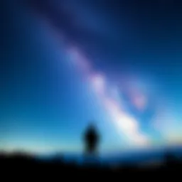 Silhouette of a person looking at the stars A person standing on a hilltop, gazing at a starry night sky filled with bright stars, representing the search for answers in life.