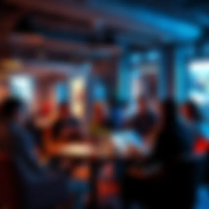 A group of people discussing and providing feedback on various portfolios in a casual setting.