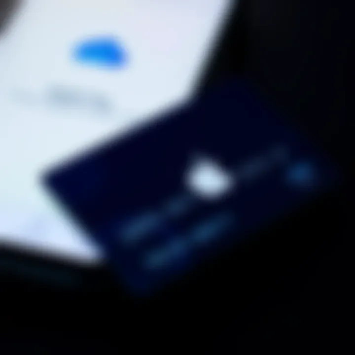 A close-up of a Singapore debit card against a smartphone screen displaying the Apple Pay interface