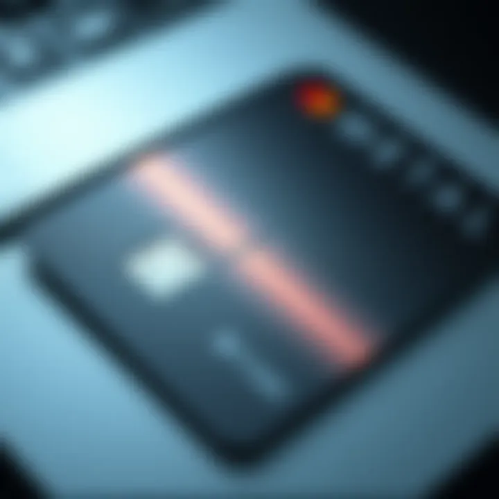 A close-up view of a metallic credit card with a sleek design, showcasing its shiny finish and the cardholder's name.