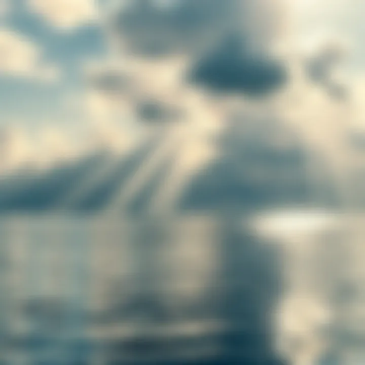 Sunbeams breaking through clouds create bright reflections on the surface of a calm body of water.