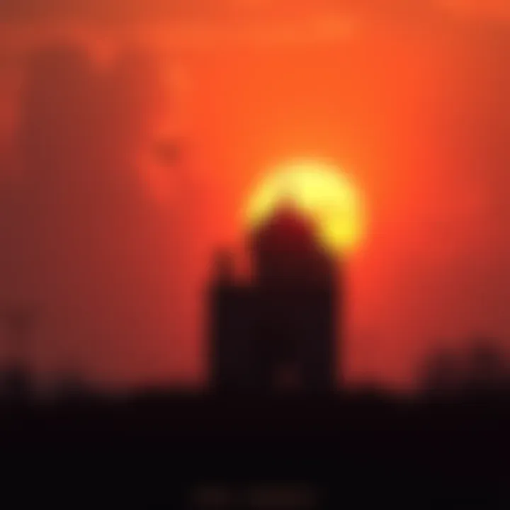 A beautiful sunset casting shadows over an old landmark, symbolizing loss and nostalgia